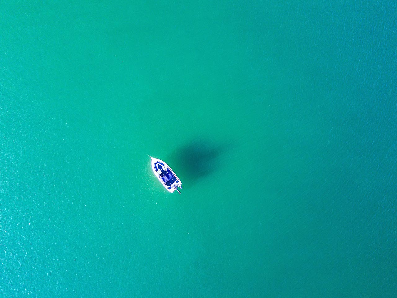 a boat in an ocean negative space