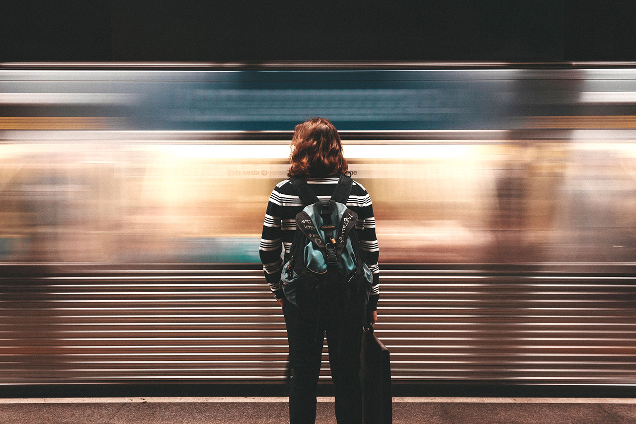 portrait with moving train in background