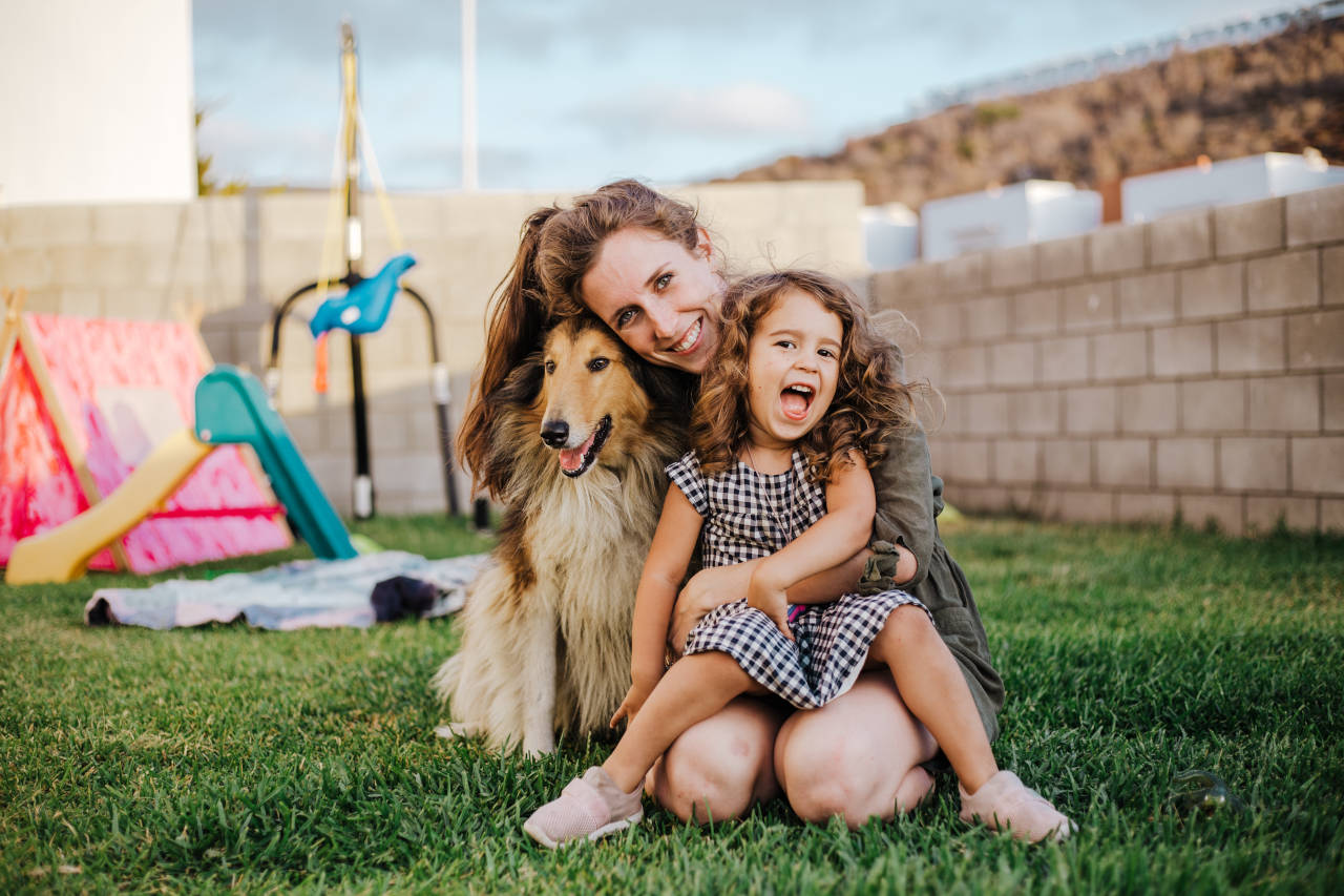 mother and daughter with their dog