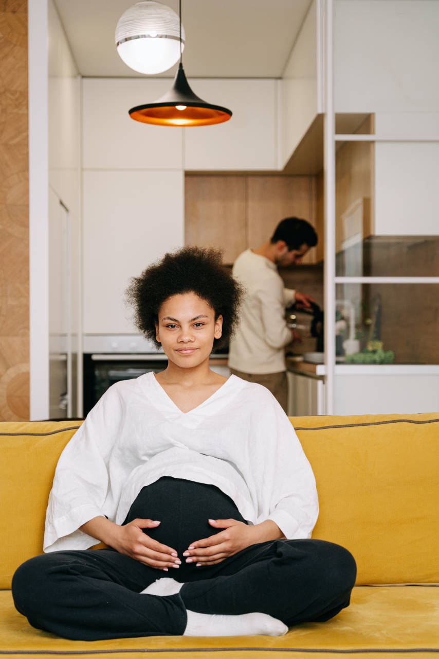 father running chores for maternity photoshoot