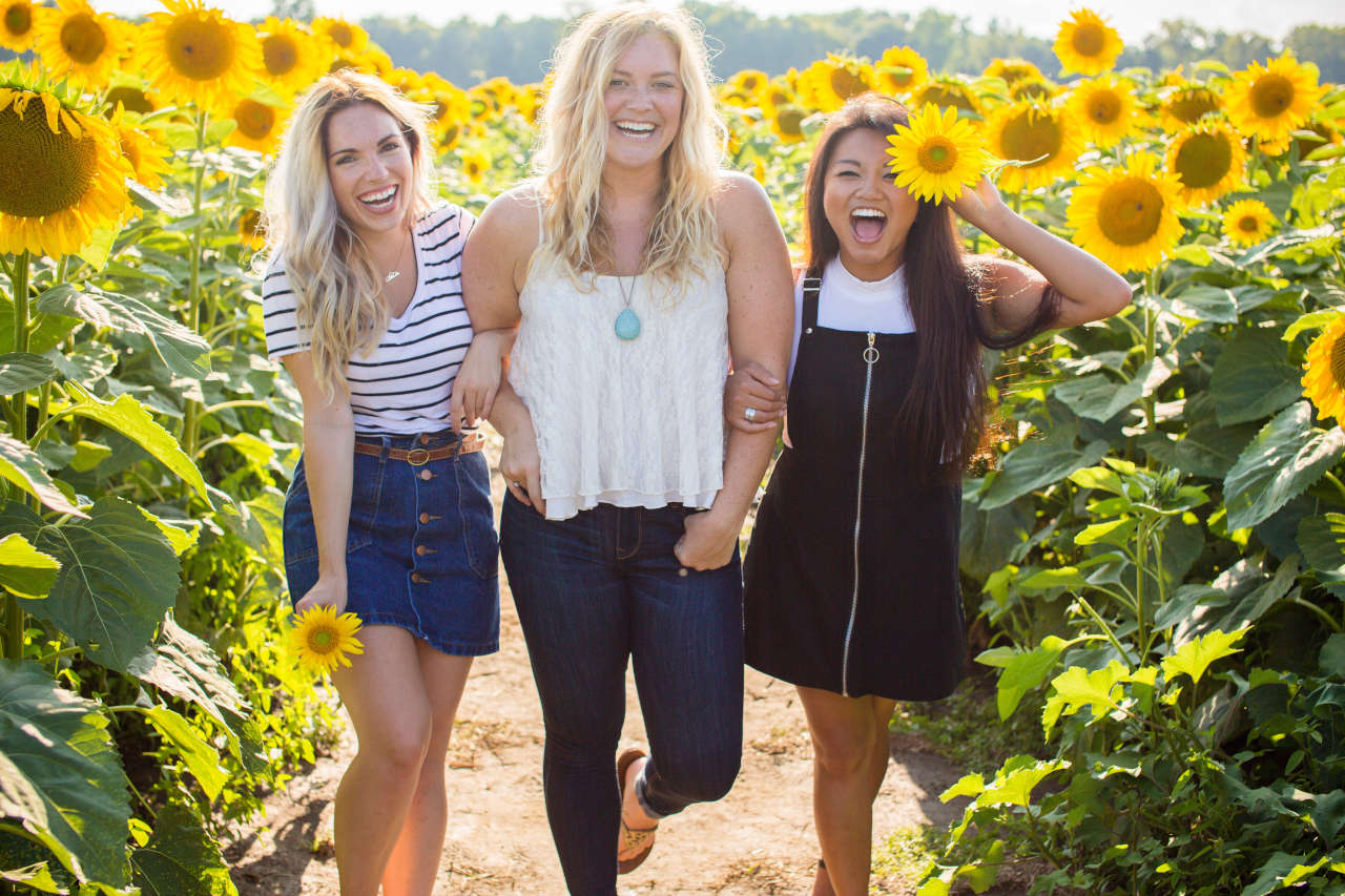 friends in a sunflower farm