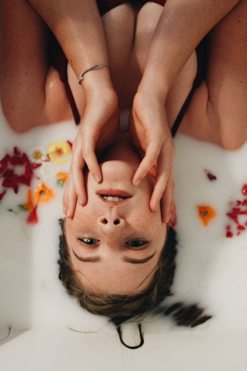 portrait of a girl in milk bath