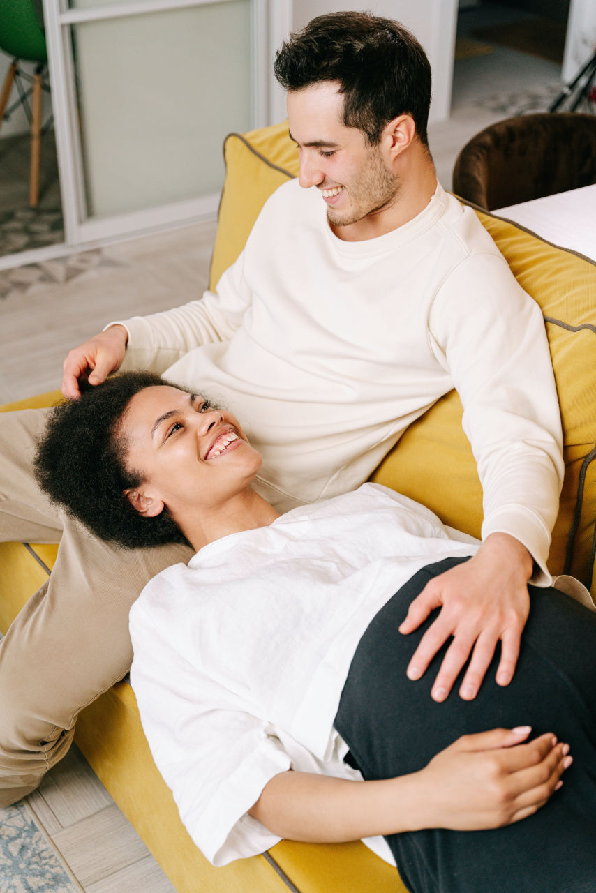 pregnant woman on man's lap