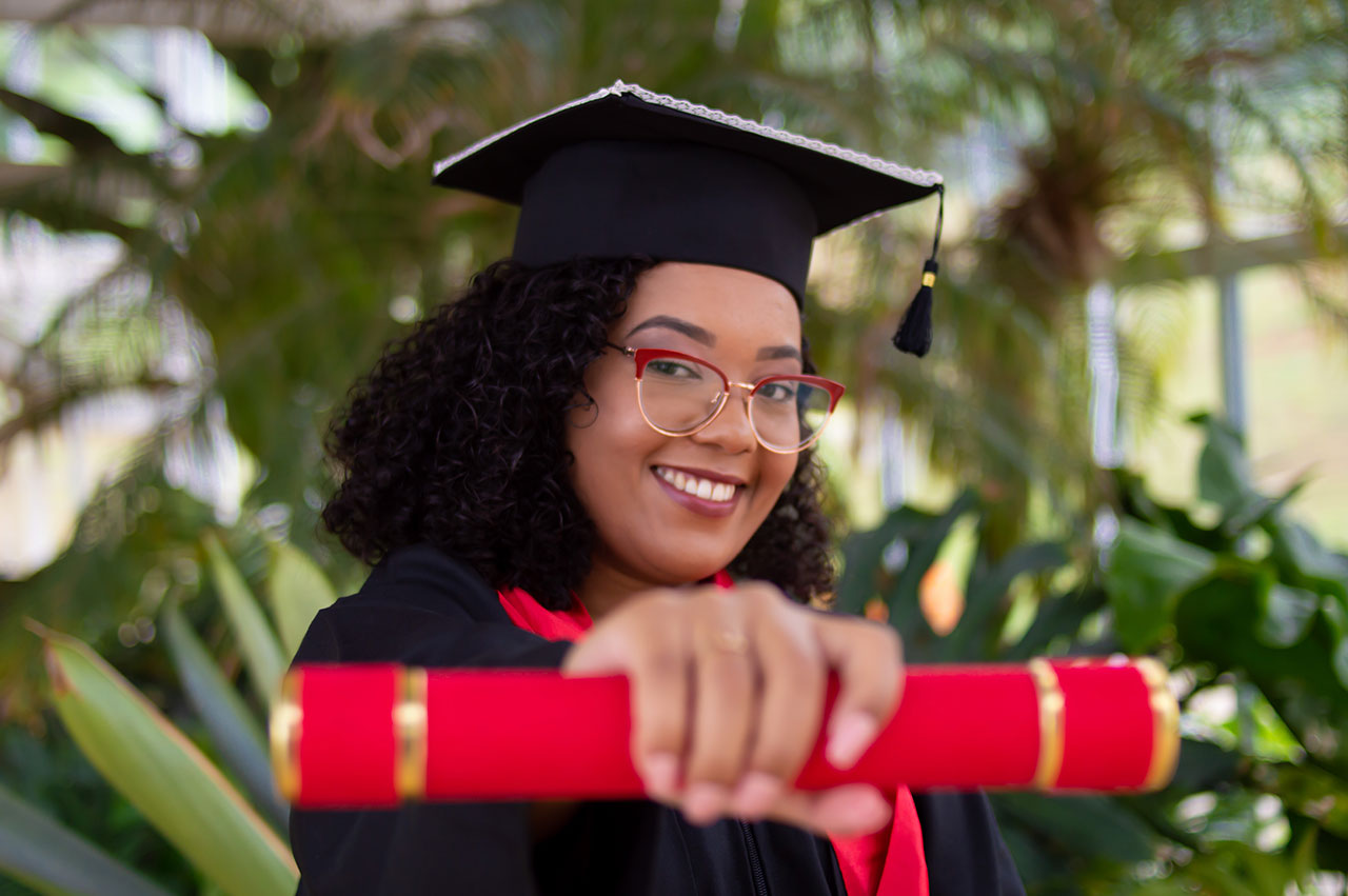 posing with a diploma