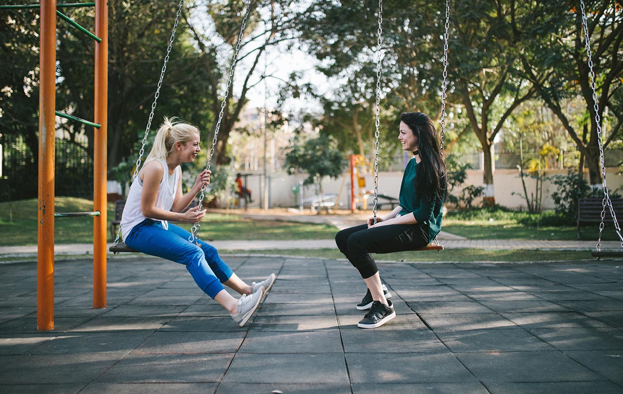 two best friends on a swing for photoshoot