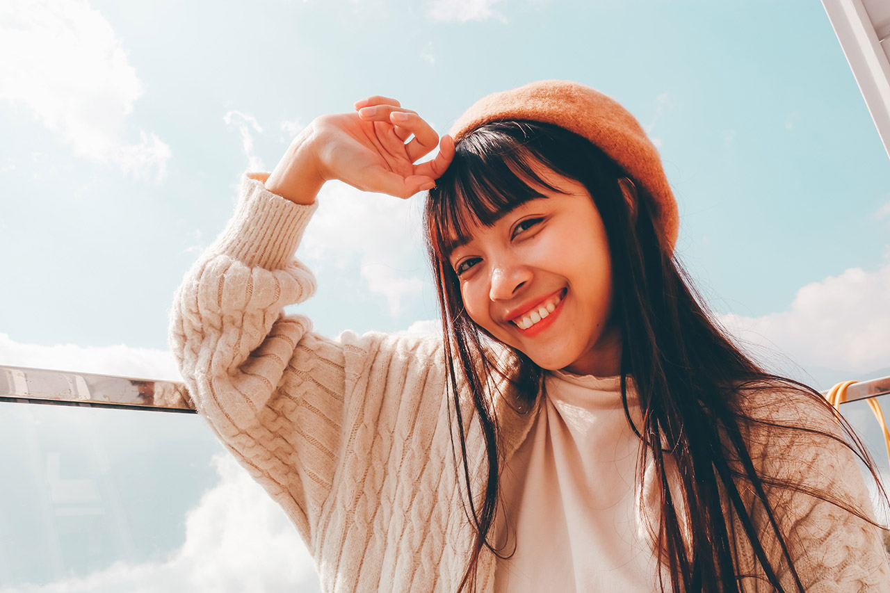 selfie of a girl with hand on head